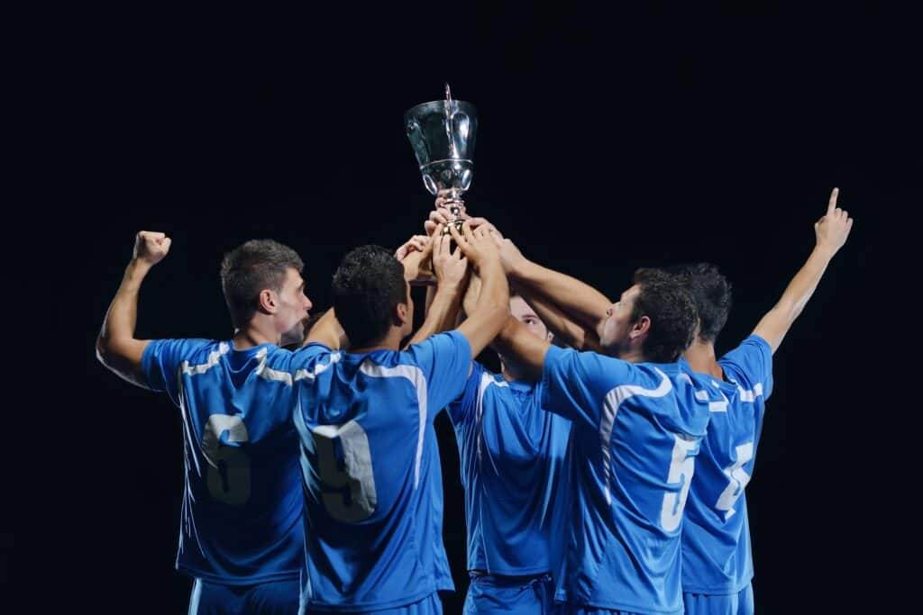 soccer players celebrating victory