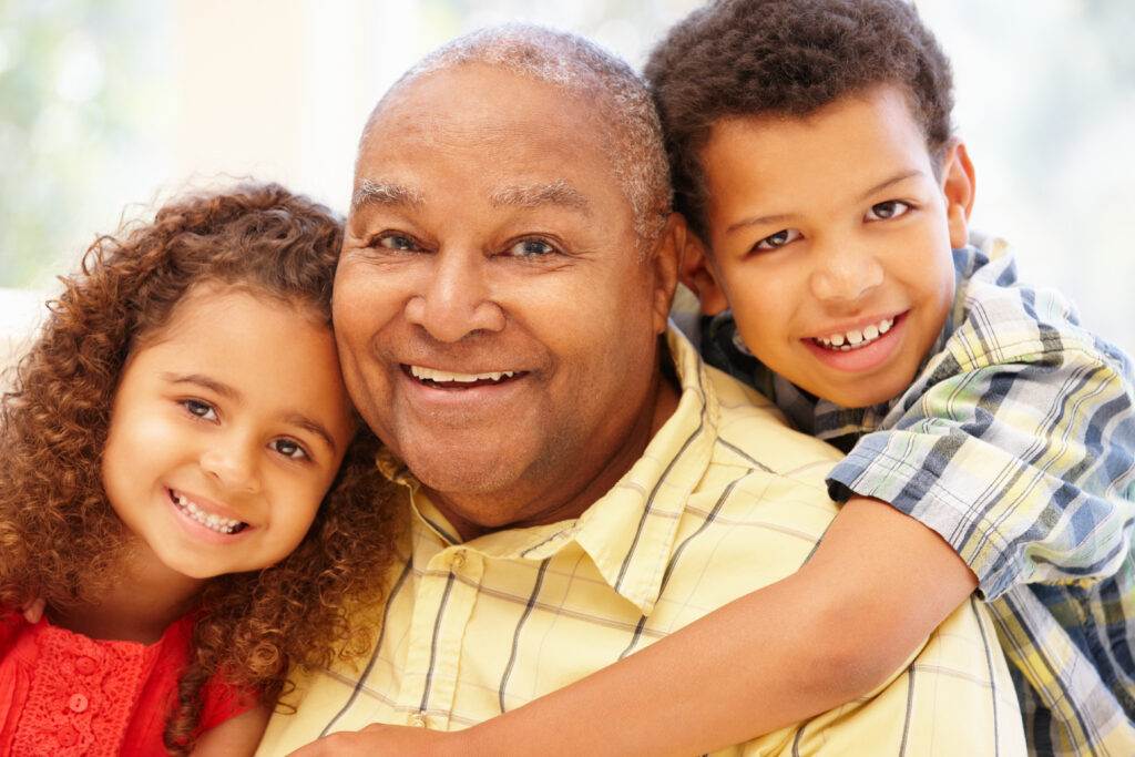 Senior African American man and grandchildren
