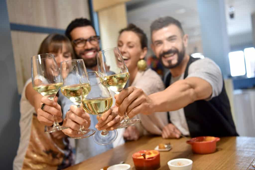 Portrait of friends in a bar drinking wine