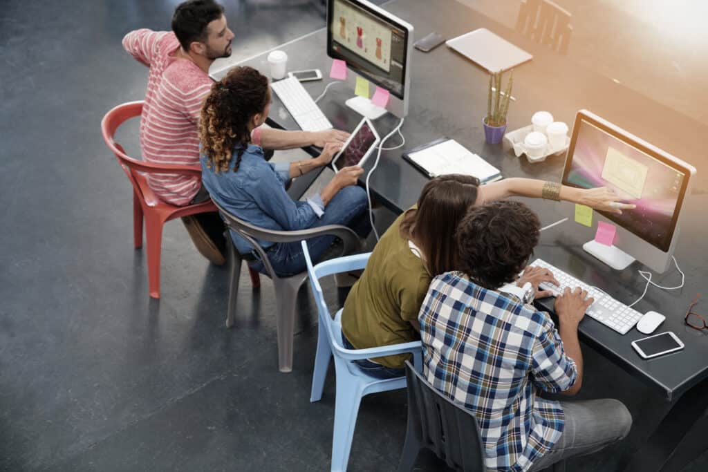 Upper view of start-up people working in open co-working office