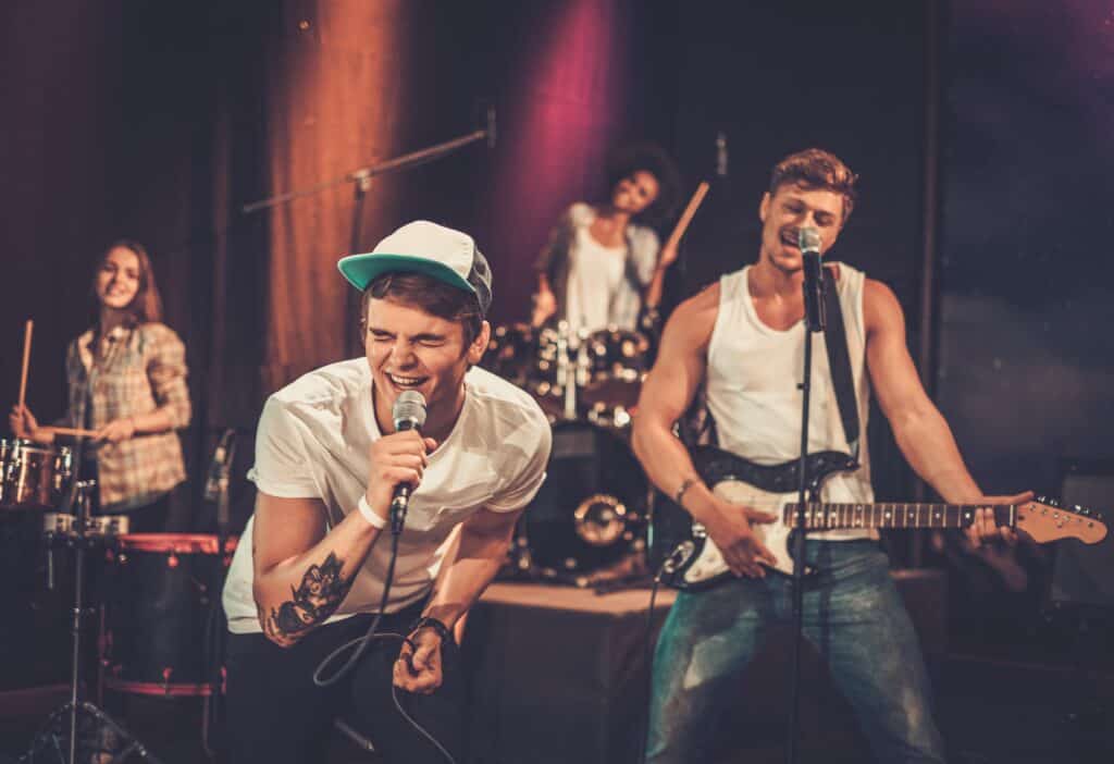 Multiracial music band performing on a stage