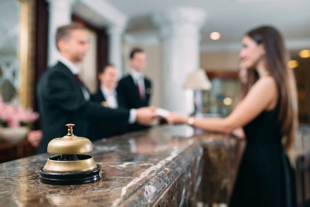 Picture of guests getting key card in hotel