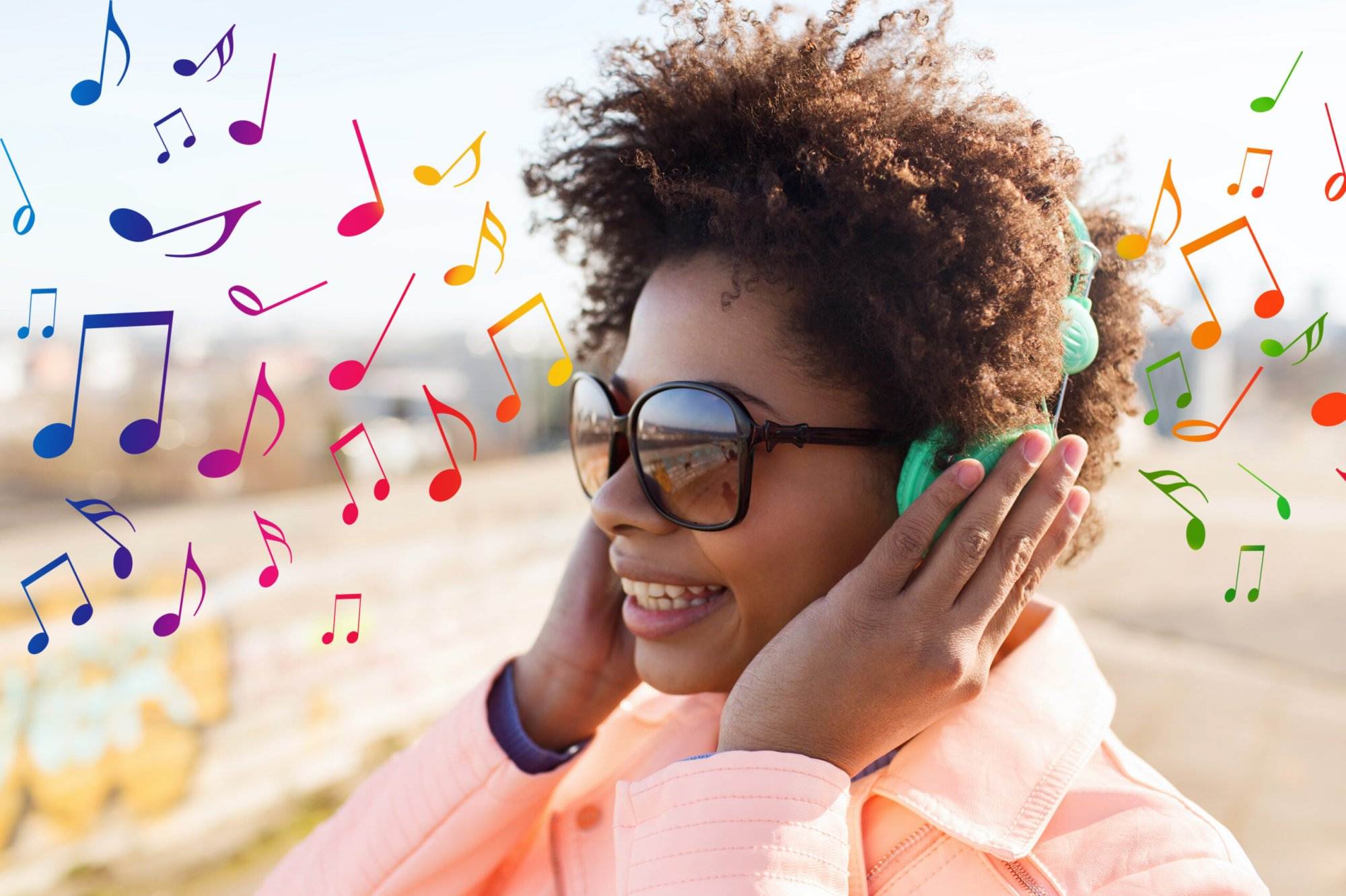 happy young woman in headphones listening to music