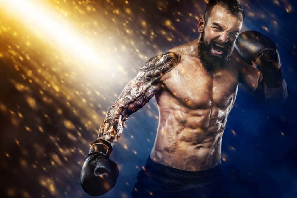 Street fighter fighting in boxing cage. Background with lights and smoke. Action shot with copy space.