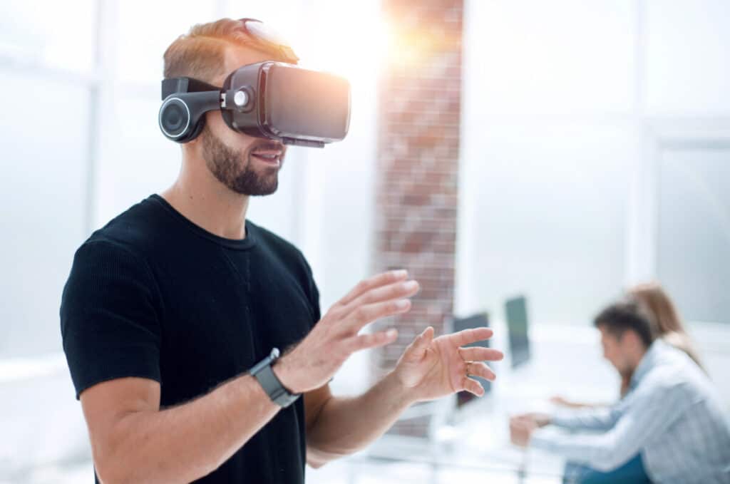 Hipster on confident face driving car in virtual reality with modern digital gadget.