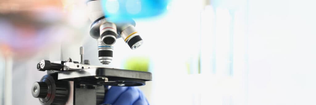 Microscope in laboratory for study of biology and chemistry. Chemical research concept