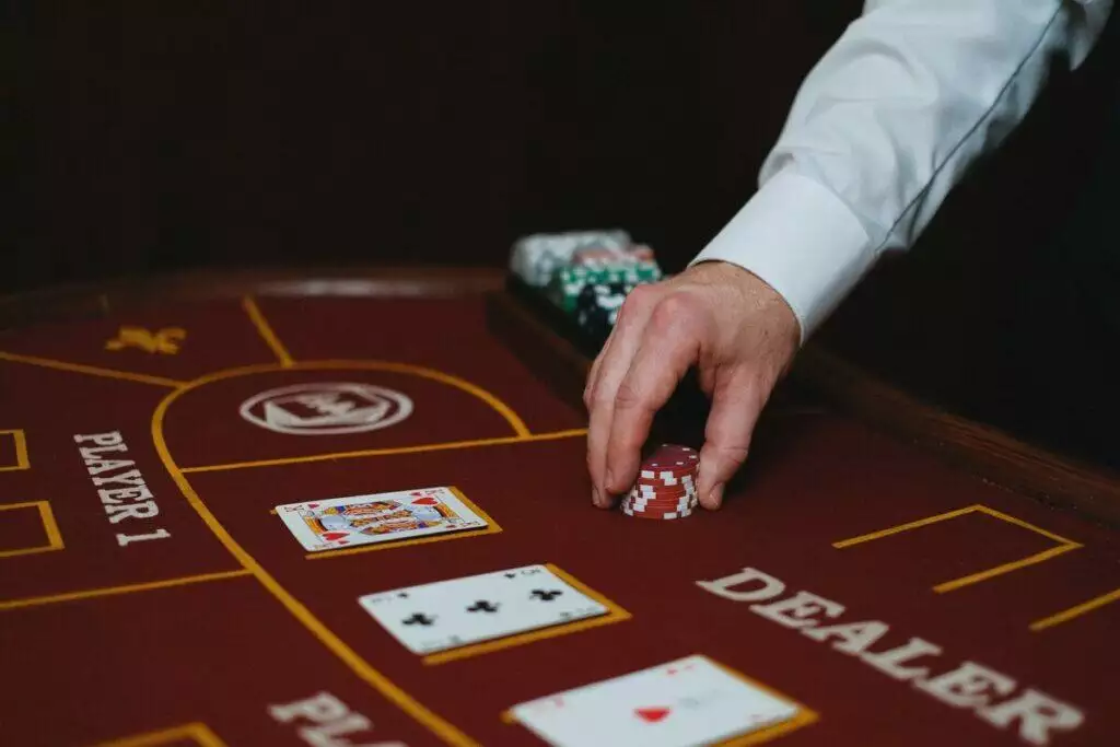 Close-up of Croupier Putting Chips on Table