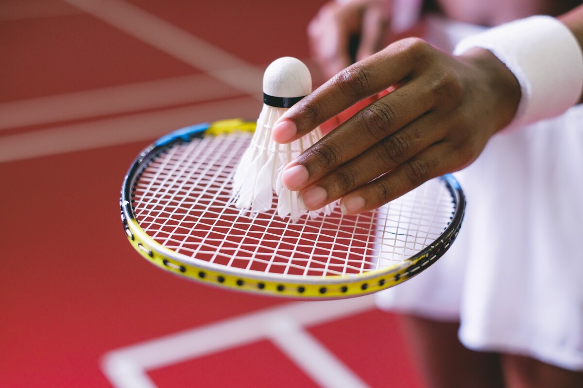 Close-Up Shot of a Shuttlecock on a Badminton Racket