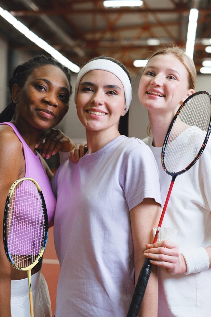 Women With Badminton Rackets